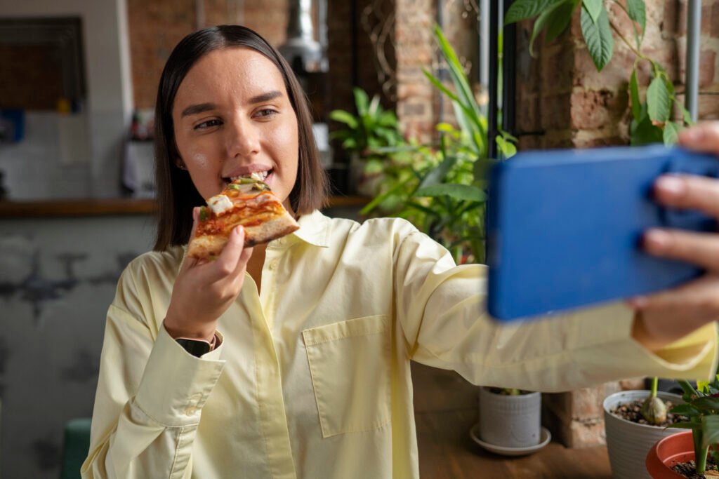 front view woman eating delicious pizza